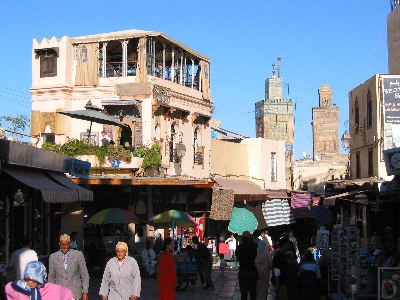 Market, restaurant, and minarets in Fès